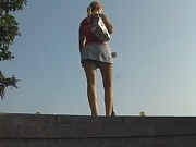 Miniskirt upskirt video of a saucy babe on the bridge